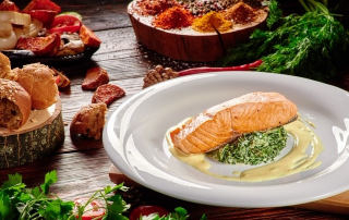 Salmon on a bed of spinach