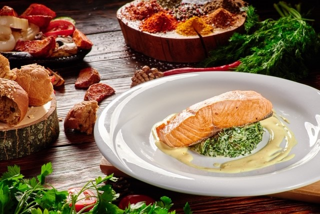 Salmon on a bed of spinach